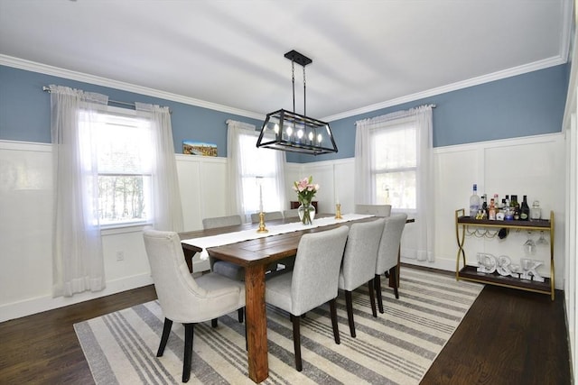 dining area with a healthy amount of sunlight and dark hardwood / wood-style flooring