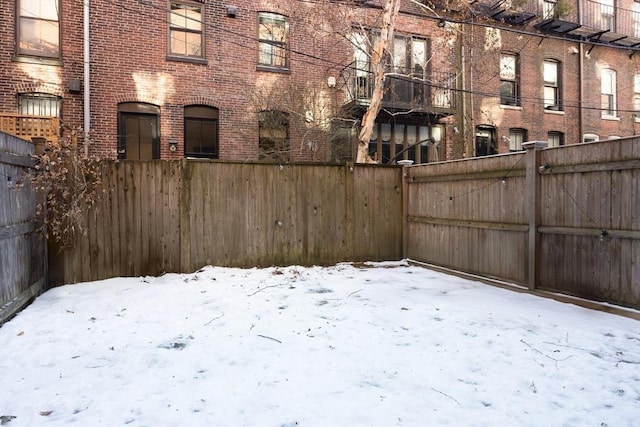 view of yard covered in snow