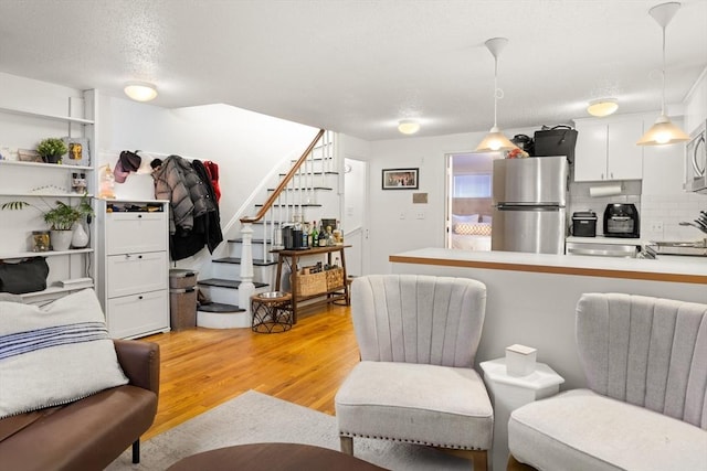 living room with light hardwood / wood-style flooring