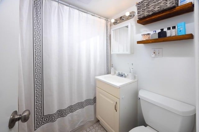 bathroom with vanity and toilet