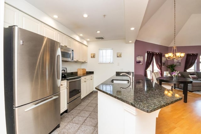 501 Commerce Dr Unit 1304, Braintree, MA 02184 - kitchen with stainless steel appliances, a sink, recessed lighting, a chandelier, and a breakfast bar