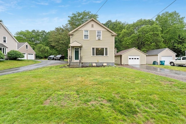 235 Union St, Northbridge, MA 01588 - view of front facade with a detached garage, a front lawn, and an outdoor structure