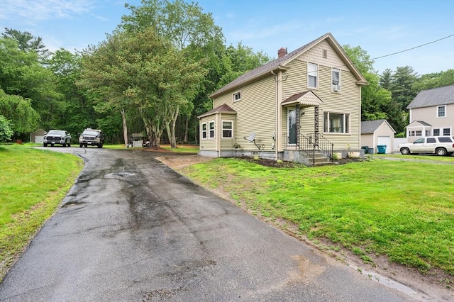 235 Union St, Northbridge, MA 01588 - traditional-style house with a chimney, driveway, and a front lawn