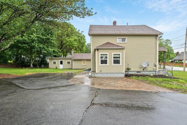 235 Union St, Northbridge, MA 01588 - back of house with a chimney, a lawn, and a shingled roof
