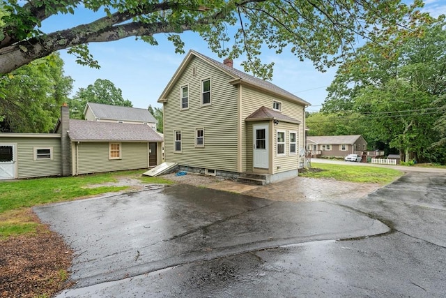 235 Union St, Northbridge, MA 01588 - view of home's exterior featuring a chimney and a yard