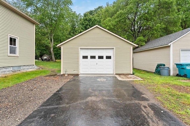 235 Union St, Northbridge, MA 01588 - detached garage with driveway and view of wooded area