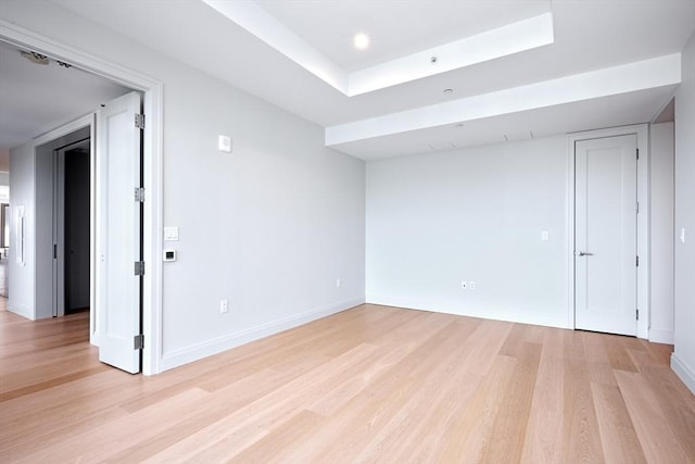 unfurnished room featuring light wood-type flooring