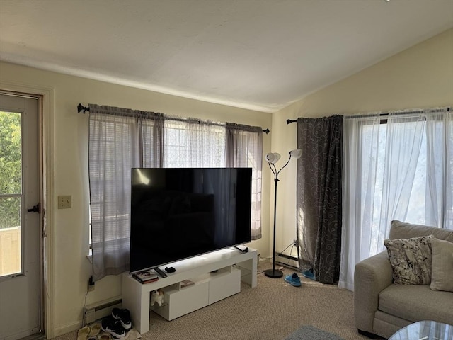 living area with a baseboard heating unit, lofted ceiling, carpet, and baseboards