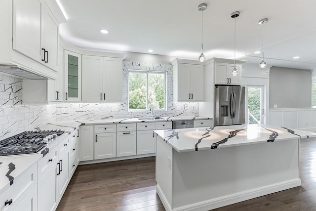 kitchen featuring stainless steel appliances, white cabinets, and dark wood-style flooring