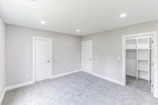 unfurnished bedroom featuring recessed lighting, baseboards, and carpet floors