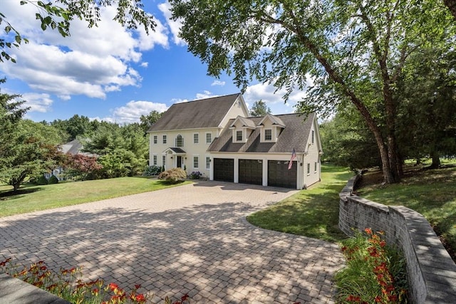 63 High St, Shrewsbury, MA 01545 - colonial home with a front lawn, driveway, and an attached garage
