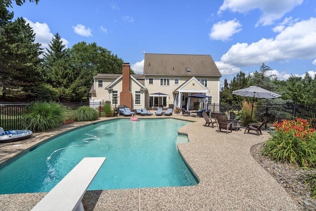 63 High St, Shrewsbury, MA 01545 - view of pool with a patio area, a fenced in pool, a fenced backyard, and a diving board