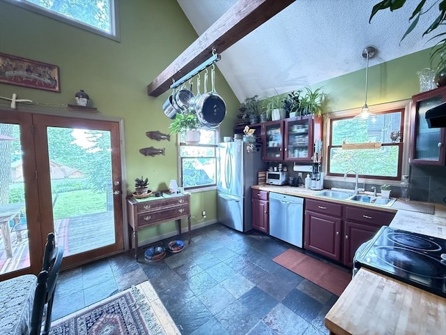 26 Horseshoe Cir, Ware, MA 01082 - kitchen featuring stainless steel appliances, a sink, stone tile flooring, light countertops, and decorative light fixtures