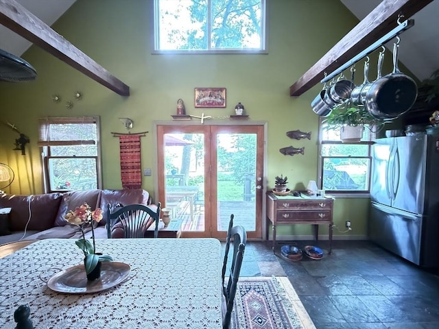 26 Horseshoe Cir, Ware, MA 01082 - dining room featuring stone tile floors, baseboards, healthy amount of natural light, and a high ceiling