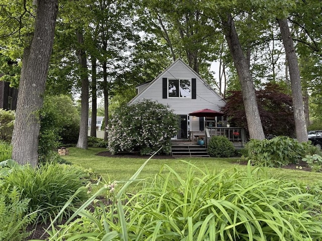 26 Horseshoe Cir, Ware, MA 01082 - view of front of property featuring a wooden deck and a front lawn