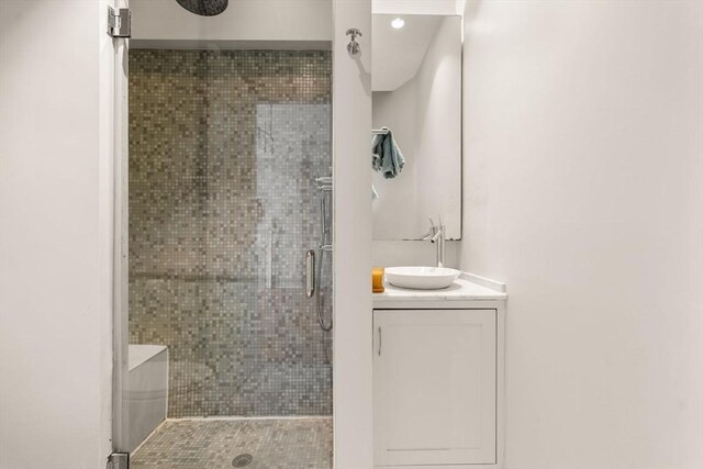 bathroom featuring vanity and a stall shower