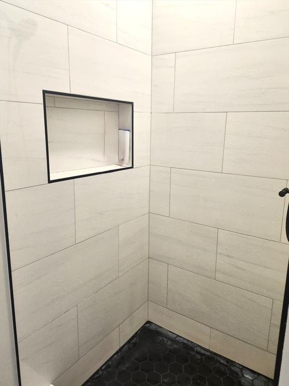 202 Broadway Unit 2-1, Lawrence, MA 01840 - bathroom featuring a tile shower