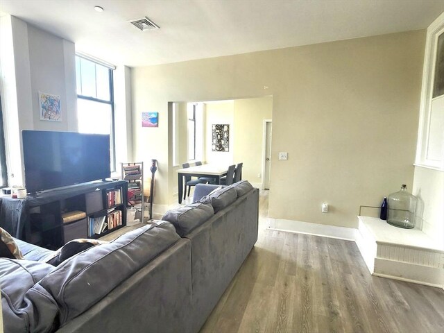 202 Broadway Unit 2-1, Lawrence, MA 01840 - living room with wood finished floors and baseboards