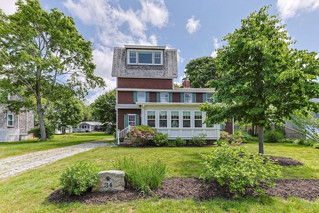 34 Kenwood Rd, Bourne, MA 02559 - view of front of house with a front yard and a chimney