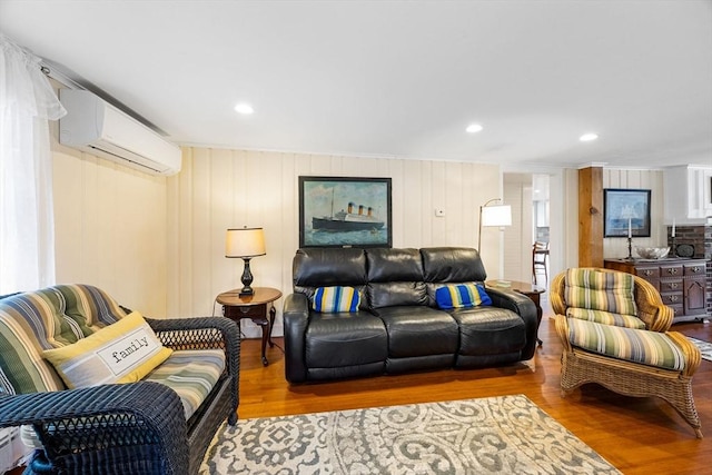 34 Kenwood Rd, Bourne, MA 02559 - living area featuring a wall unit AC, wood finished floors, ornamental molding, and recessed lighting