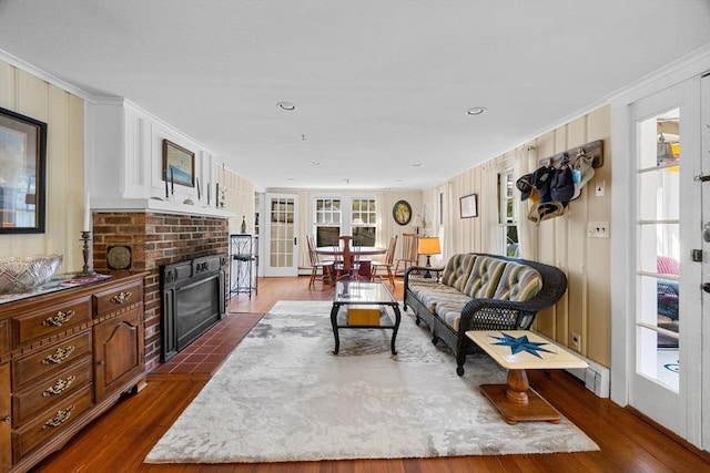 34 Kenwood Rd, Bourne, MA 02559 - living area featuring a fireplace, dark wood-style flooring, and crown molding