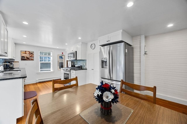 34 Kenwood Rd, Bourne, MA 02559 - dining area with baseboard heating, recessed lighting, and light wood finished floors