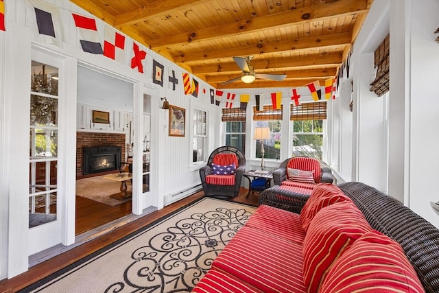 34 Kenwood Rd, Bourne, MA 02559 - sunroom / solarium featuring baseboard heating, a ceiling fan, beam ceiling, and a fireplace