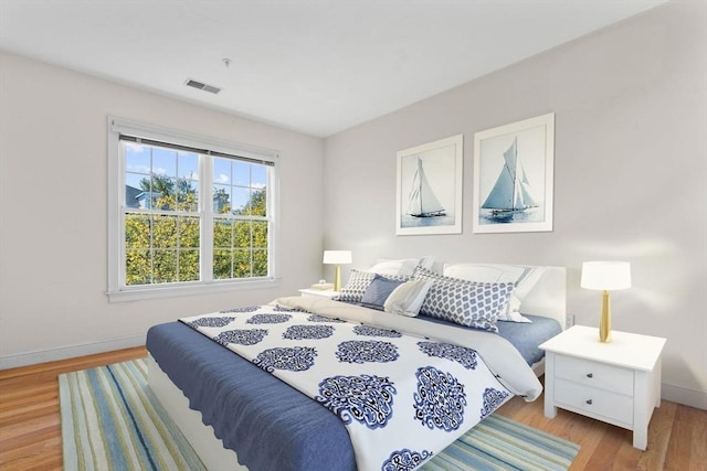 bedroom featuring light wood-type flooring