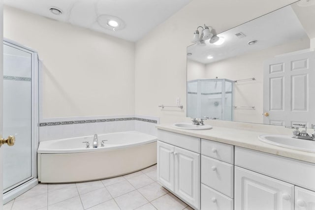 bathroom featuring vanity, independent shower and bath, and tile patterned floors