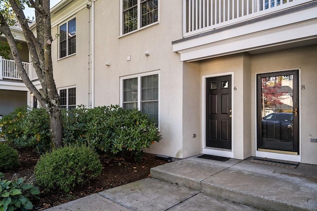 doorway to property featuring a balcony