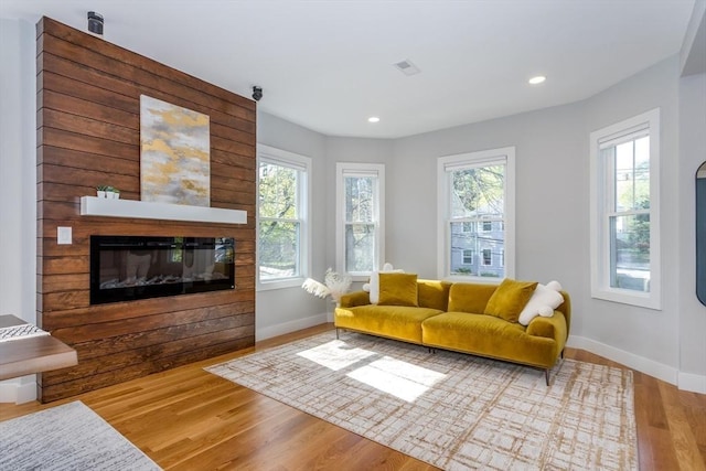 61 Paul Revere Rd Unit 2, Arlington, MA 02476 - living room with recessed lighting, baseboards, a glass covered fireplace, and wood finished floors