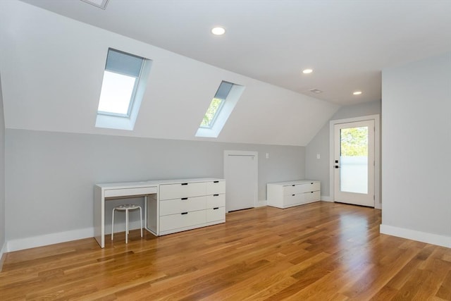 61 Paul Revere Rd Unit 2, Arlington, MA 02476 - bonus room with light wood finished floors, baseboards, vaulted ceiling with skylight, and recessed lighting