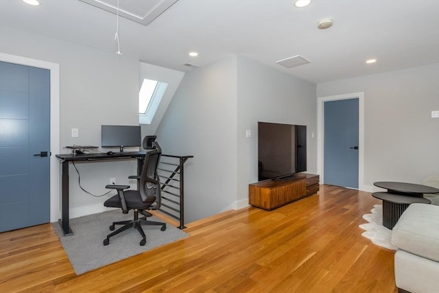 61 Paul Revere Rd Unit 2, Arlington, MA 02476 - home office featuring wood finished floors, attic access, a skylight, visible vents, and recessed lighting