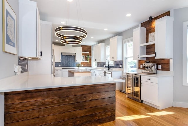 61 Paul Revere Rd Unit 2, Arlington, MA 02476 - kitchen with decorative backsplash, open shelves, and beverage cooler