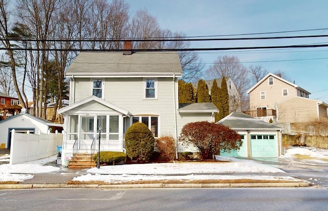 view of front property with an outbuilding and a garage