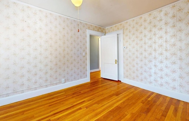 unfurnished room featuring hardwood / wood-style flooring