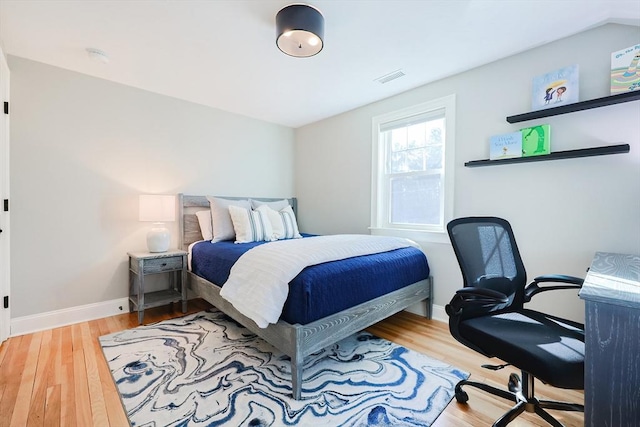 bedroom with wood-type flooring