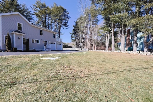 view of yard featuring a garage