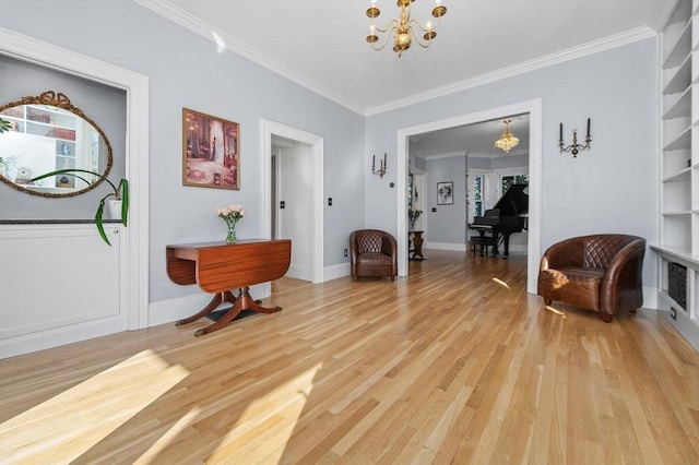 interior space featuring light wood-style flooring, baseboards, a chandelier, and crown molding