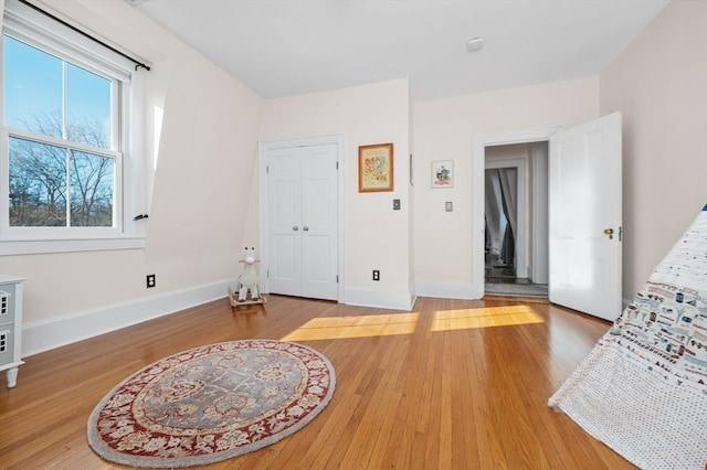 interior space with light wood-style flooring and baseboards