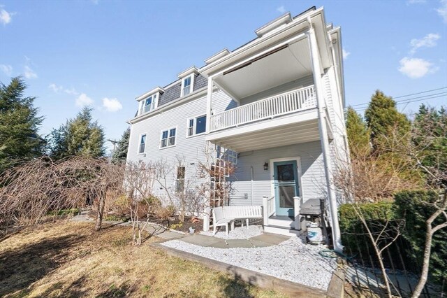 rear view of house with a balcony