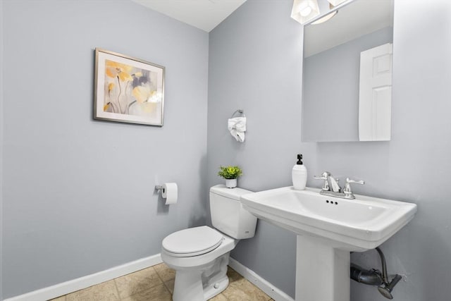 bathroom featuring sink and toilet