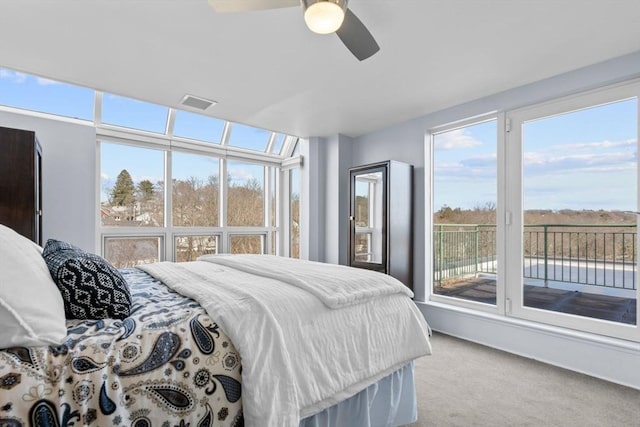 bedroom with light carpet and ceiling fan