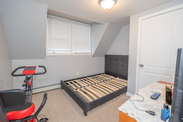 bedroom featuring baseboard heating and light colored carpet