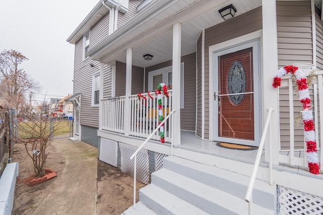 doorway to property featuring a porch