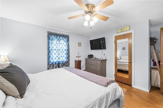 bedroom featuring ceiling fan and light hardwood / wood-style flooring