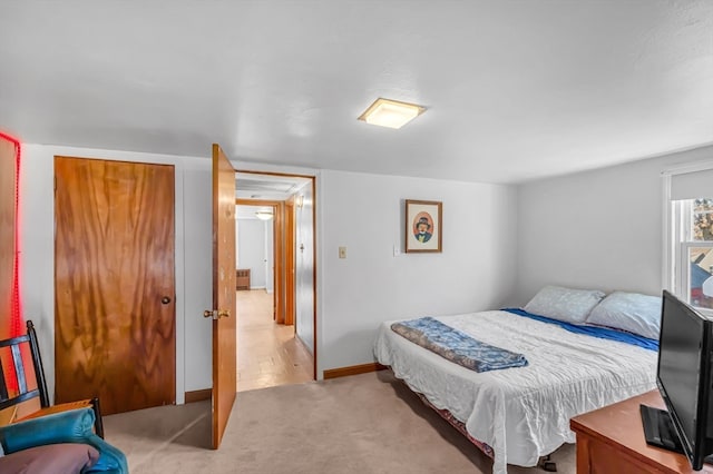 bedroom featuring light colored carpet