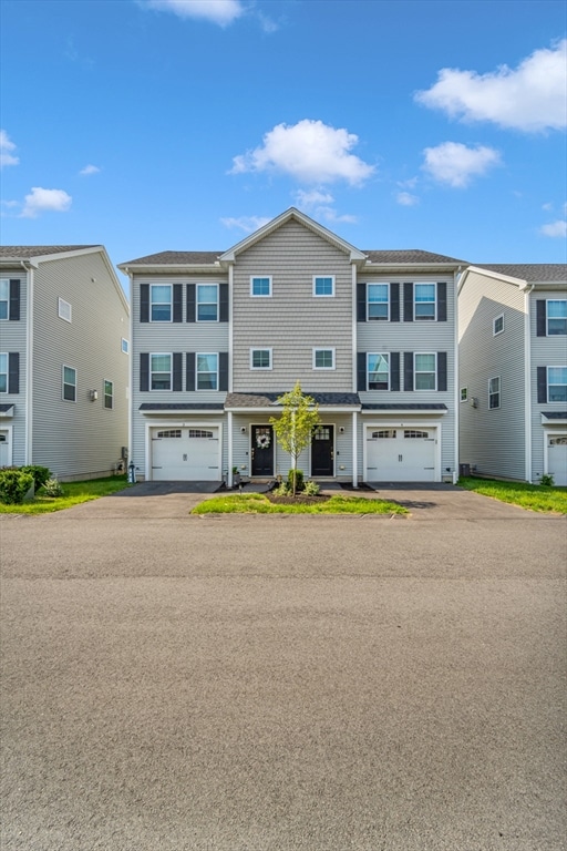 1400 Gorham Unit 3, Lowell, MA 01852 - townhome / multi-family property featuring driveway and a garage