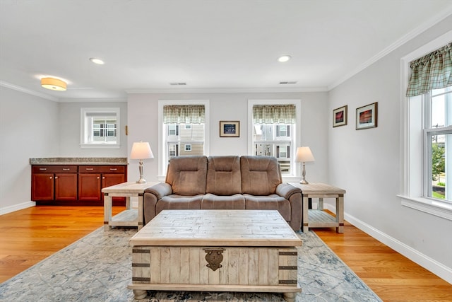 1400 Gorham Unit 3, Lowell, MA 01852 - living room with crown molding, light wood finished floors, and recessed lighting