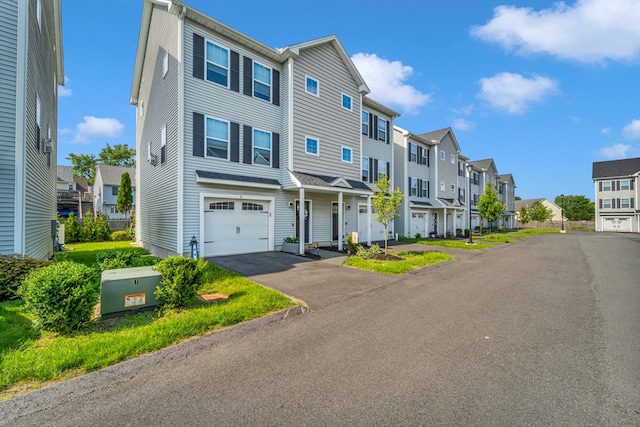 1400 Gorham Unit 3, Lowell, MA 01852 - view of front of house with a residential view, a garage, and asphalt driveway